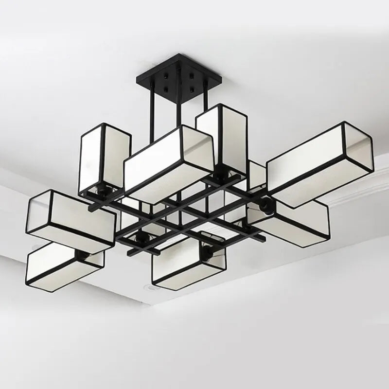 Black geometric semi-flush ceiling light with fabric shades, angled view.
