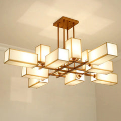 Close-up of the black geometric frame and fabric shades of the semi-flush ceiling light.