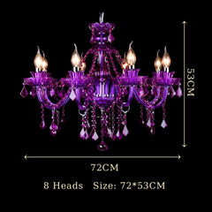 The red crystal chandelier as installed in a luxurious room setting, casting warm light.