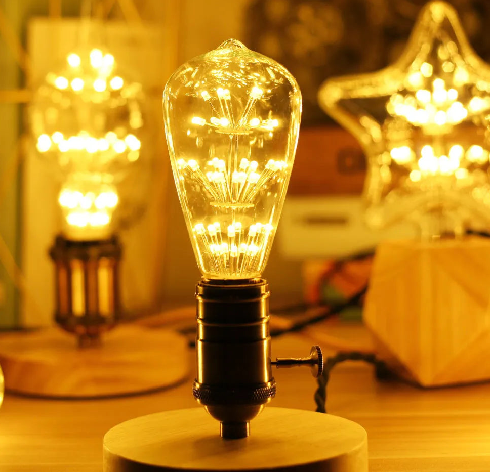 Vintage-style light bulb on a wooden base with warm glow