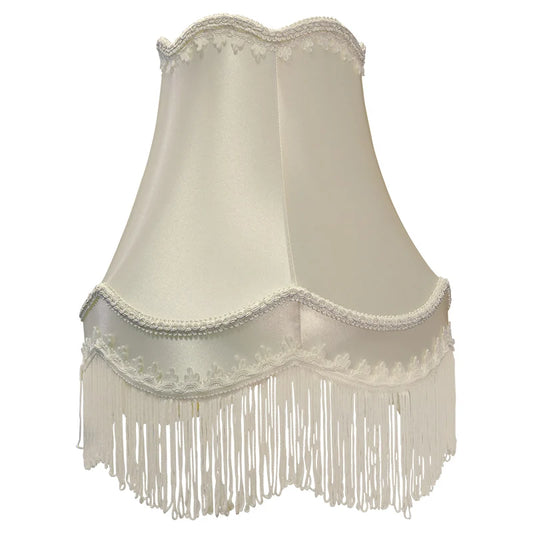 Cream fabric bell lampshade with decorative white fringe and scalloped trim