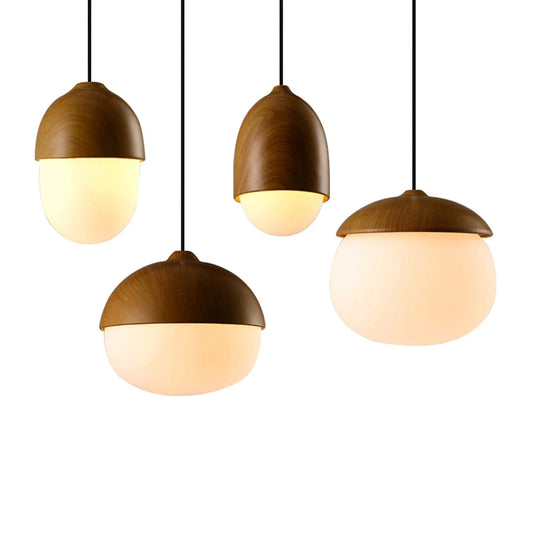 Four modern pendant lights with wood-textured tops and frosted glass diffusers, arranged against a white background.