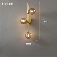 Modern Gold Brass Sconce with Three Frosted Globe Shades