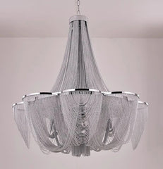 Chandelier with silver mesh design on a plain background