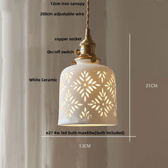 White ceramic pendant light with decorative cut-out design, measurements, and specifications.