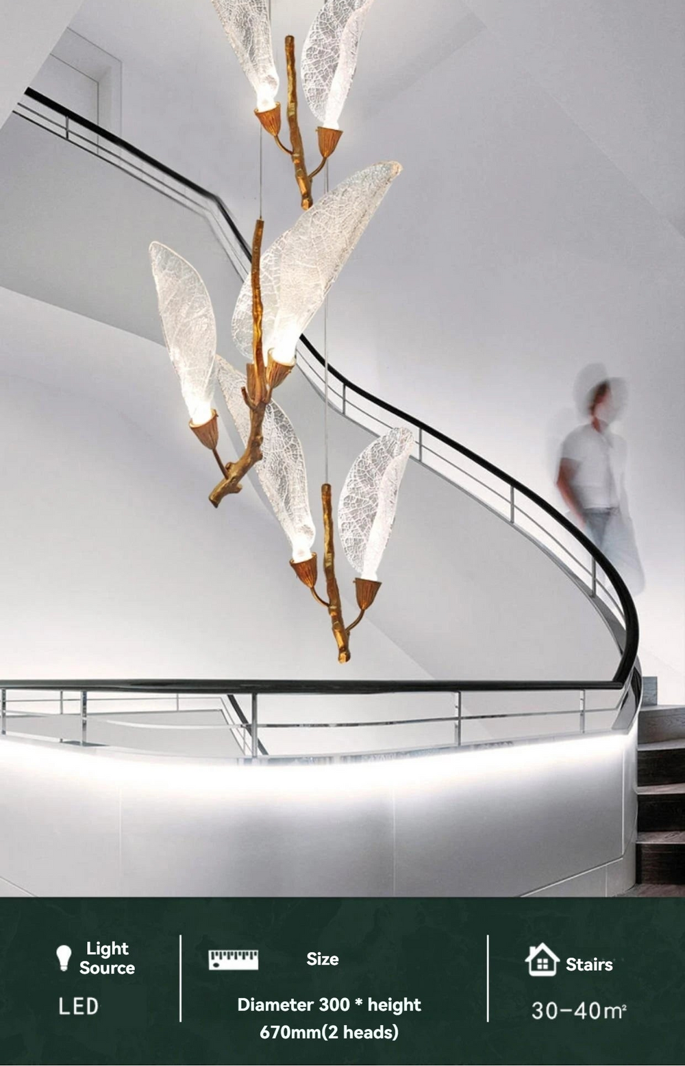 Modern chandelier with leaf-like design hanging over a staircase.