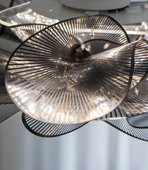 Close-up of a modern ceiling light fixture with intricate design