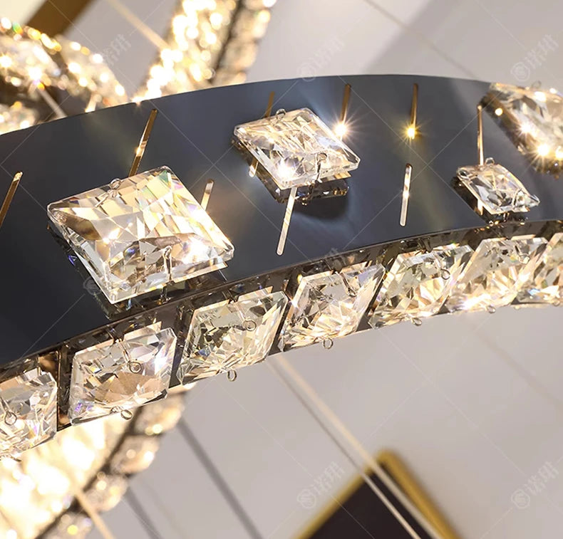 Close-up of a decorative mirror with crystal-like embellishments on a black frame.