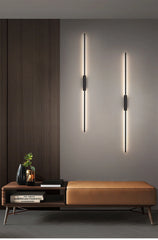 Close-up views of the thickened aluminum lamp body, LED light source, and stable base of the black linear wall sconce.