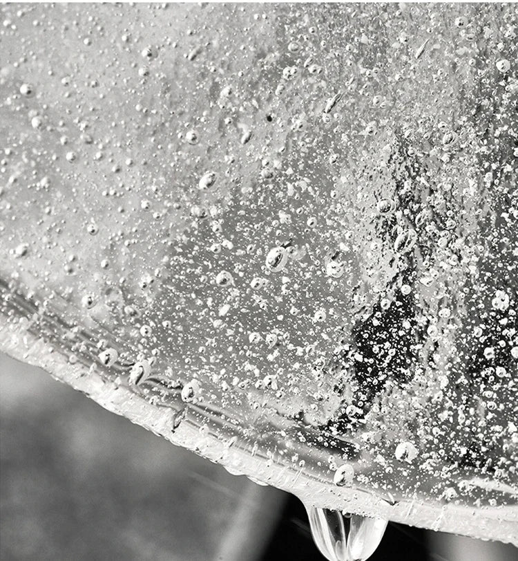 Extreme close-up showing the bubble and textured details on a clear glass disc of a pendant light.