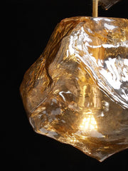 Close-up of a rough diamond crystal on a black background