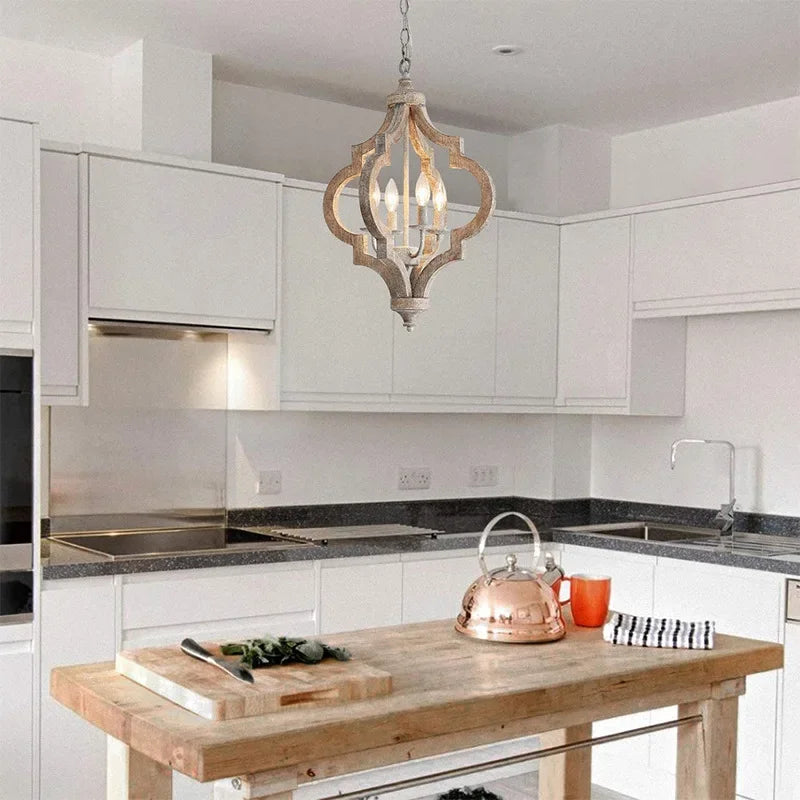 Modern kitchen with wooden island, copper kettle, and pendant light.