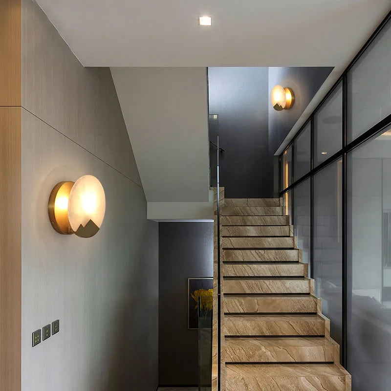 Modern staircase with wall lights in a contemporary interior setting