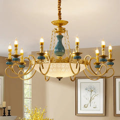 Gold candelabra chandelier with teal ceramic accents and glass shades, mounted on a ceiling.