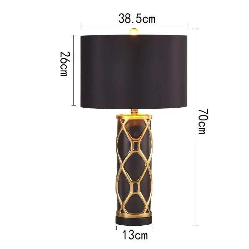 Black table lamp with gold accents and dimensions on a white background