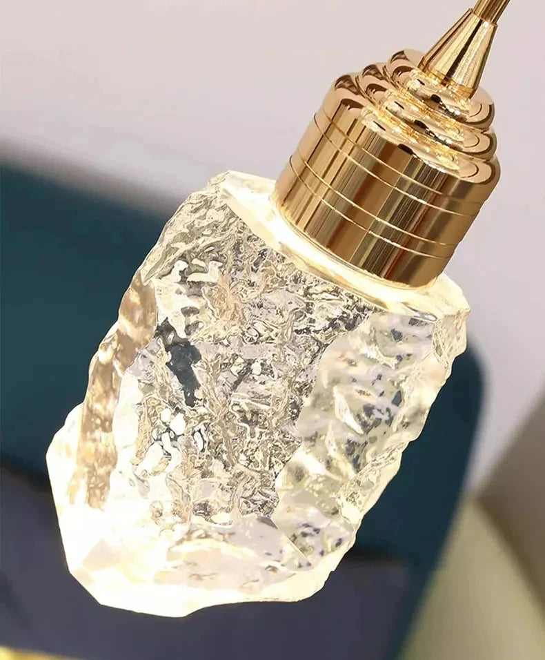 Crystal bottle with gold cap on a dark background