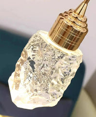 Crystal bottle with gold cap on a dark background