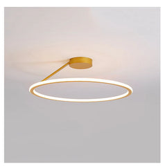 Modern ceiling light fixture with circular design on a plain background