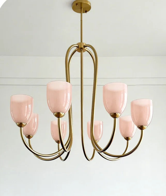 A close-up detail of a white glass shade on a gold-toned fixture.
