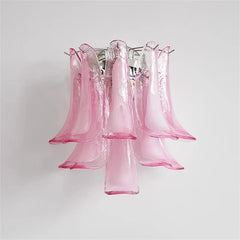 Close-up of a pink Murano glass petal wall sconce, showcasing the glass texture and chrome frame.