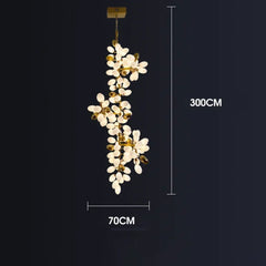 Chandelier with floral design and measurement details on a black background