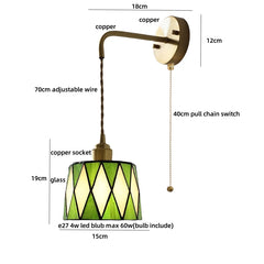 Pendant light with green glass shade and brass arm, showing measurements and features.