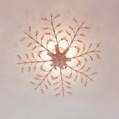 Overhead view of a pink floral semi-flush ceiling light with crystal accents, showing its radial design.