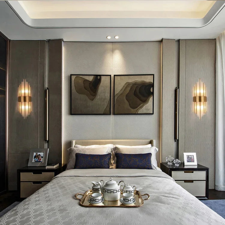 Modern bedroom with a bed, nightstands, and wall art.