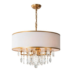 Front view of a gold drum shade chandelier with cascading clear crystals against a white background.