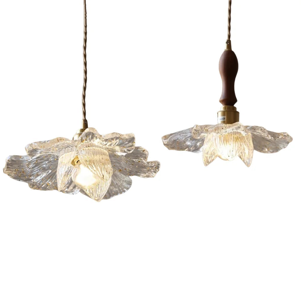Two floral-patterned pendant lights on a white background