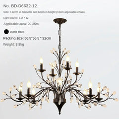 Black chandelier with crystal accents on a light gray background