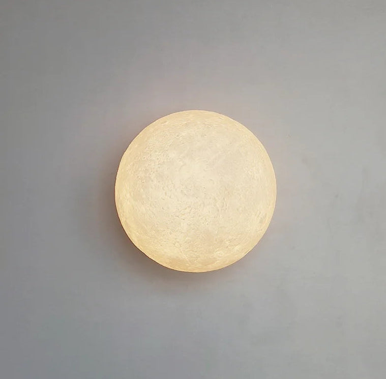 Round wall light fixture on a gray background