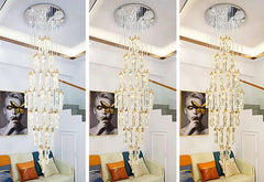 Chandelier hanging above a living room with colorful cushions.