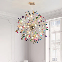 A multi-colored agate slice floral chandelier with a gold frame in a well-lit room.