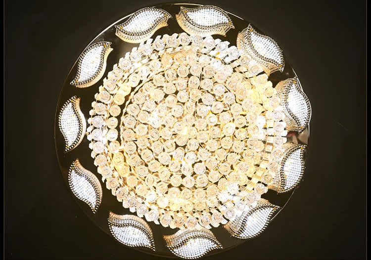 Ceiling light fixture with decorative leaves on a dark background