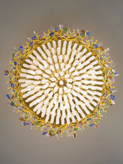 Decorative ceiling light fixture with gold frame and multicolored beads on a gray background
