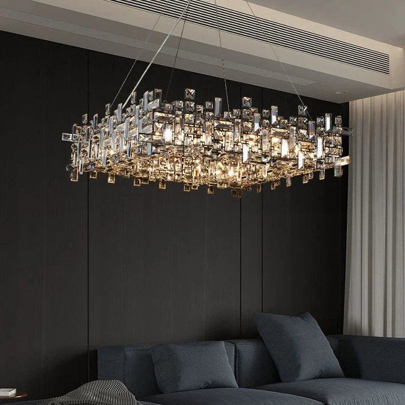 Close-up of the polished chrome chandelier, showcasing the detailed arrangement of crystal elements and the reflective chrome frame.