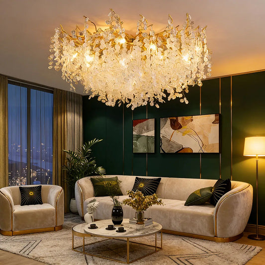 Gold cascading crystal floral chandelier illuminating a luxurious living room setting.