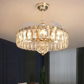 A gold and crystal tiered semi-flush ceiling light with a fan, illuminated and mounted on a white ceiling.