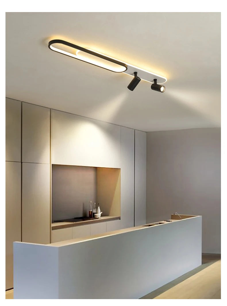 Modern kitchen interior with ceiling lights and a countertop.