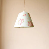 Floral-patterned lampshade on a beige background