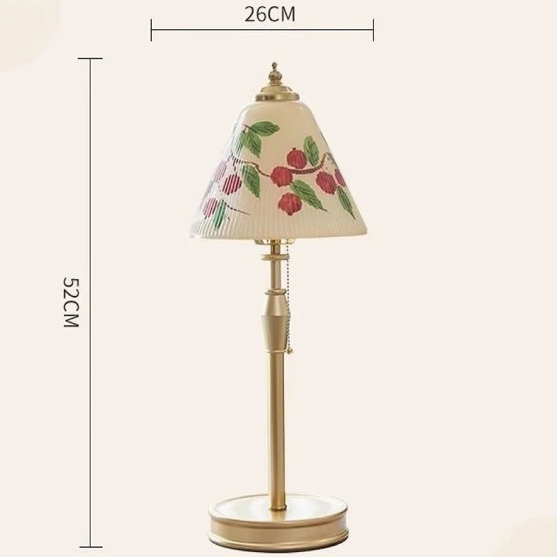 Table lamp with decorative shade and measurements on a white background