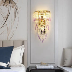 Decorative wall sconce with crystals in a bedroom setting