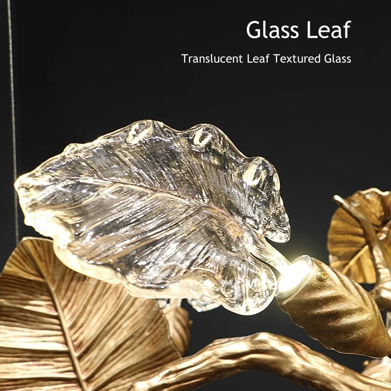 Translucent glass leaf with gold leaves on a dark background