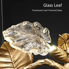 Translucent glass leaf with gold leaves on a dark background