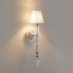 Wall-mounted lamp with crystal design on a gray wall