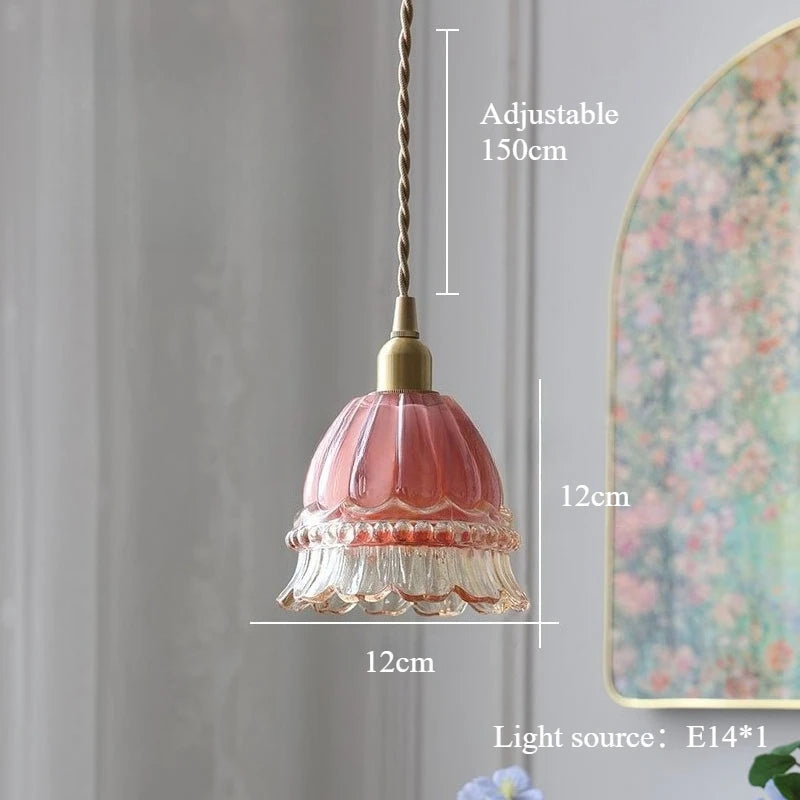 Pink pendant light with measurements against a neutral background