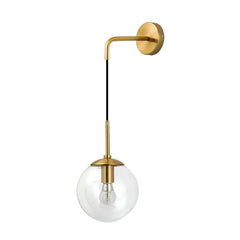 A studio shot of a gold wall sconce with a clear glass globe and exposed bulb against a white background.