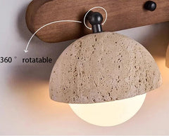 Wall-mounted light fixture with stone-like shade and wooden bracket, featuring a 360-degree rotatable feature.