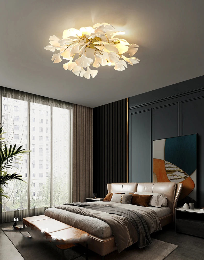 Modern bedroom with a ceiling light fixture, bed, and large window.
